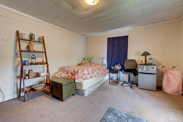 carpeted bedroom with refrigerator