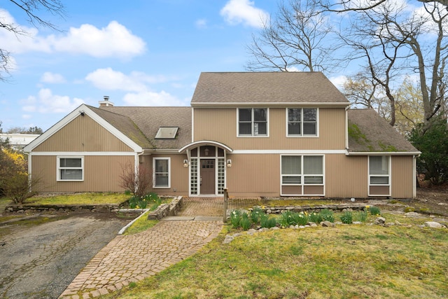 view of front of house with a front lawn