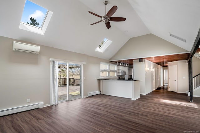 unfurnished living room featuring ceiling fan, dark wood-type flooring, baseboard heating, an AC wall unit, and vaulted ceiling with skylight