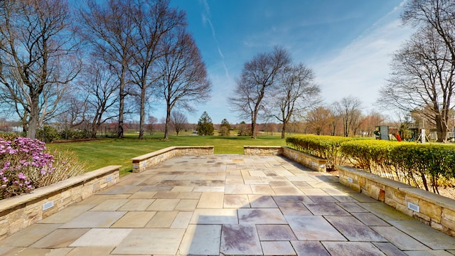 view of home's community with a yard and a patio area