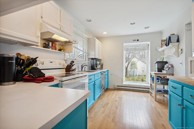 kitchen with plenty of natural light, custom range hood, and white cabinets