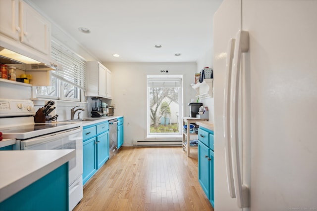 kitchen with white appliances, baseboard heating, white cabinetry, blue cabinets, and light wood-type flooring