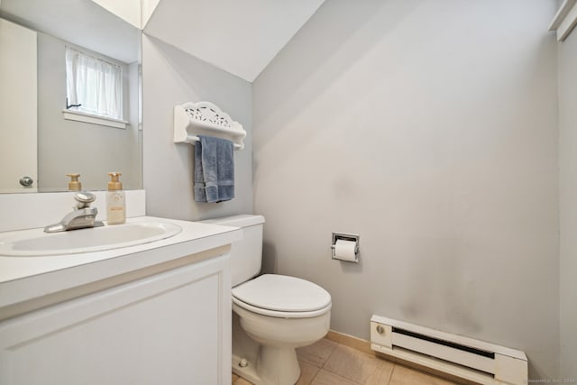 bathroom featuring vanity, tile floors, toilet, and baseboard heating