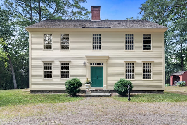 colonial home with a front yard