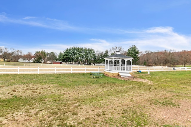 view of yard with a rural view and a gazebo