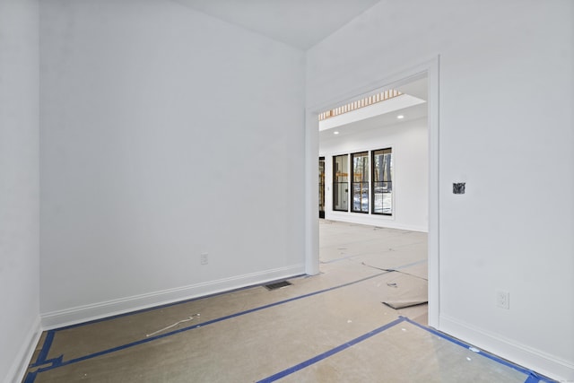 empty room with visible vents and baseboards