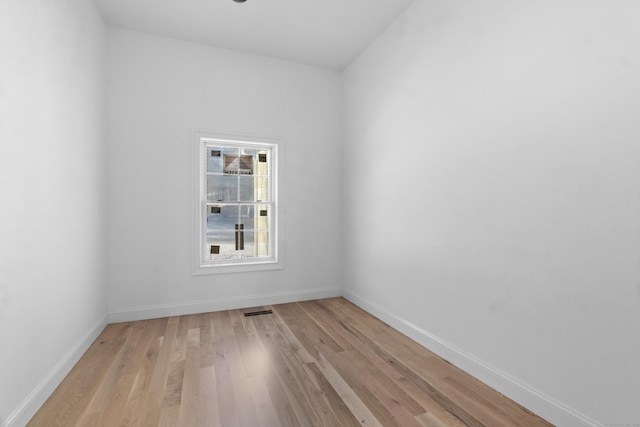 spare room with light wood-type flooring