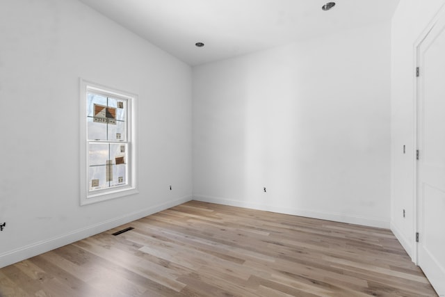 unfurnished room with light hardwood / wood-style floors