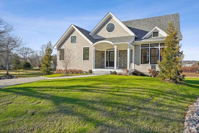 craftsman-style home with a front yard