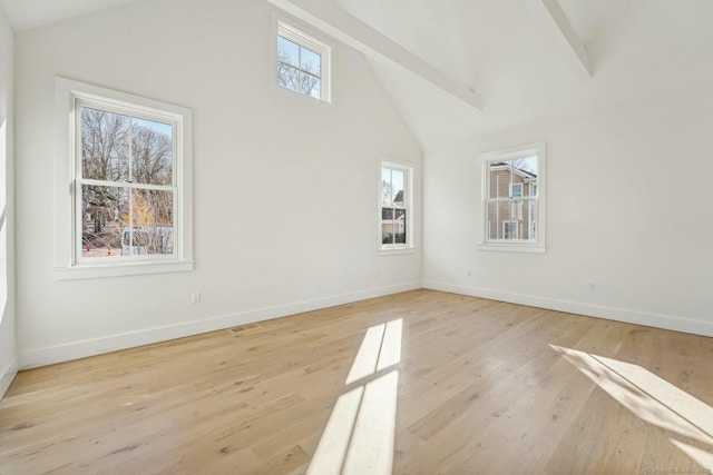 interior space featuring beam ceiling, high vaulted ceiling, and light wood-type flooring