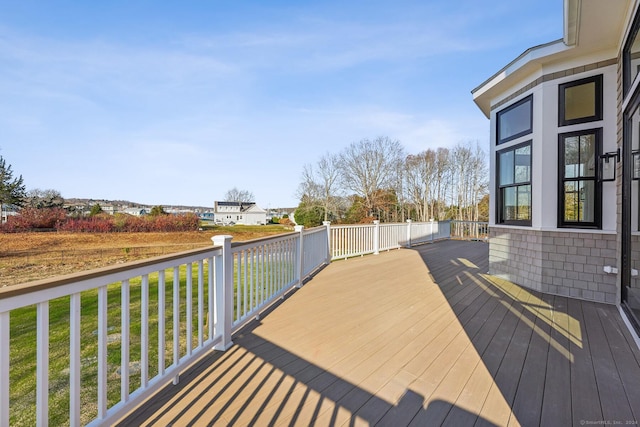 deck featuring a lawn