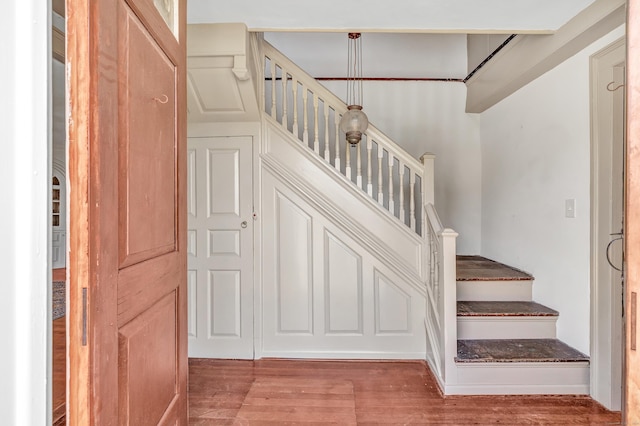 stairway featuring hardwood / wood-style floors