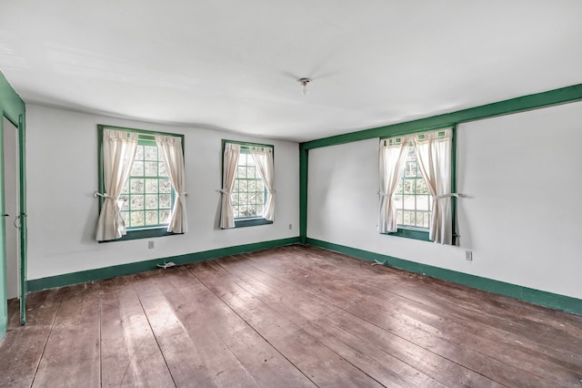 spare room featuring hardwood / wood-style floors