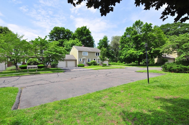29 Early Dawn Cir Unit 29, Windsor, CT 06095 - view of front of property featuring a front lawn and an attached garage