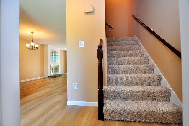 29 Early Dawn Cir Unit 29, Windsor, CT 06095 - stairway featuring wood finished floors and a chandelier