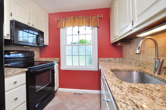 29 Early Dawn Cir Unit 29, Windsor, CT 06095 - kitchen featuring black appliances, backsplash, white cabinetry, light stone countertops, and light tile patterned floors
