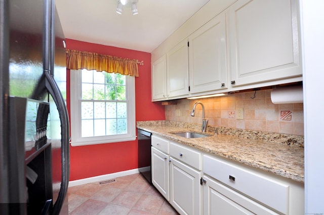 29 Early Dawn Cir Unit 29, Windsor, CT 06095 - kitchen featuring freestanding refrigerator, tasteful backsplash, dishwashing machine, and white cabinetry