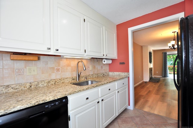 29 Early Dawn Cir Unit 29, Windsor, CT 06095 - kitchen with black appliances, decorative backsplash, white cabinets, and light stone countertops