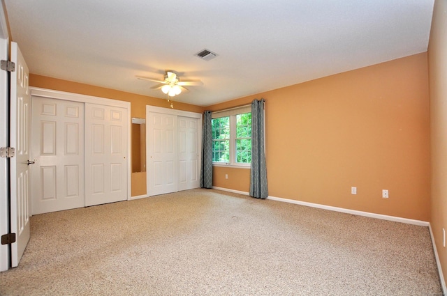 29 Early Dawn Cir Unit 29, Windsor, CT 06095 - unfurnished bedroom with two closets, carpet flooring, and a ceiling fan
