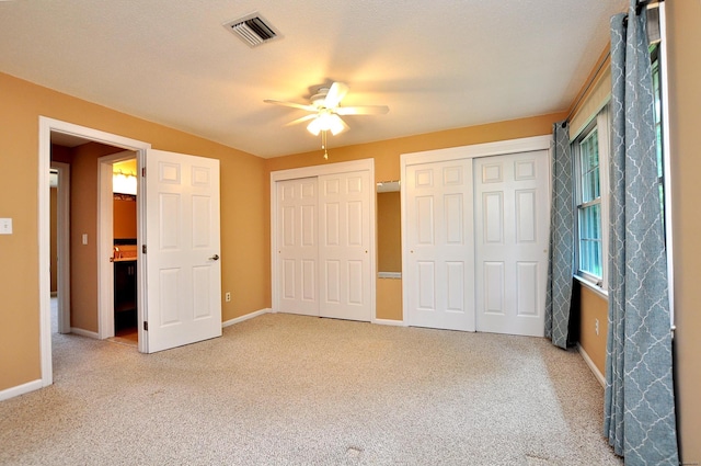 29 Early Dawn Cir Unit 29, Windsor, CT 06095 - unfurnished bedroom with multiple closets, carpet flooring, and ceiling fan