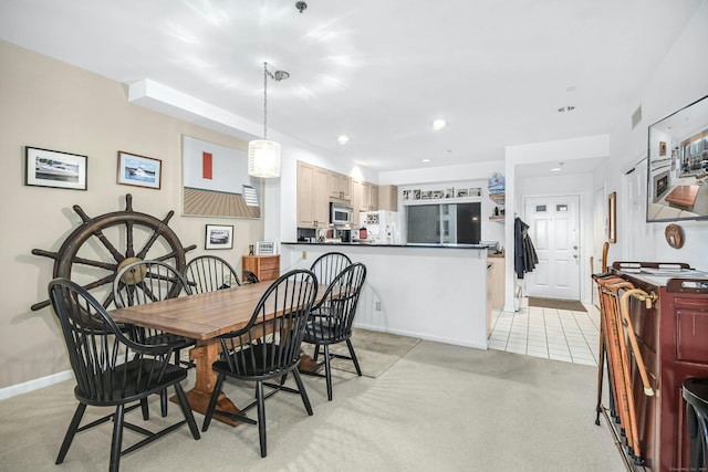 dining area with light colored carpet