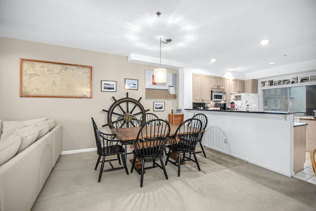 view of carpeted dining space