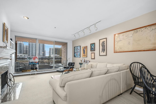 carpeted living room with rail lighting