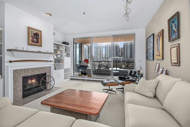 carpeted living room with track lighting