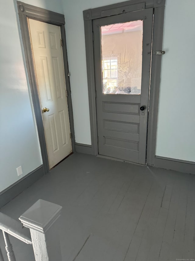 doorway with hardwood / wood-style flooring