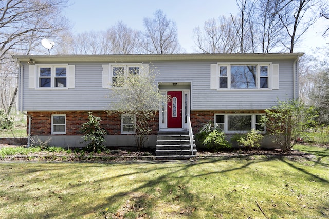 bi-level home with a front lawn