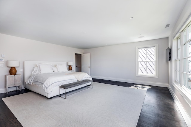 bedroom featuring dark hardwood / wood-style floors