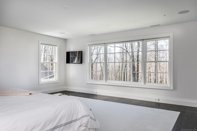 unfurnished bedroom featuring dark wood-type flooring