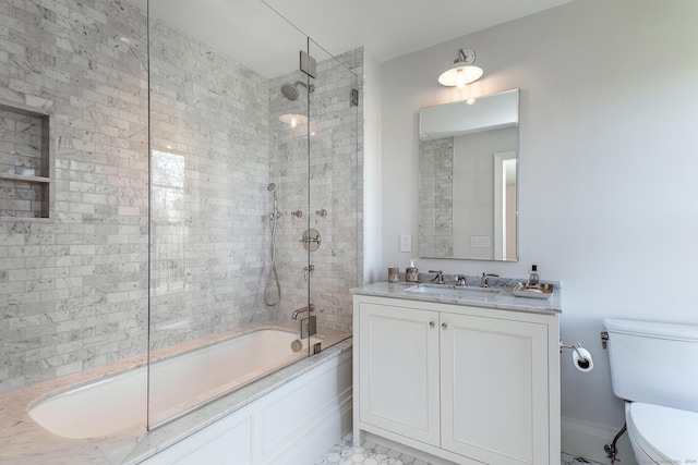 full bathroom featuring vanity, enclosed tub / shower combo, and toilet