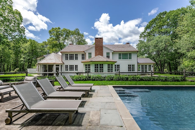 rear view of house featuring a patio