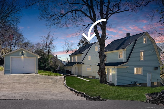 property exterior at dusk featuring a lawn