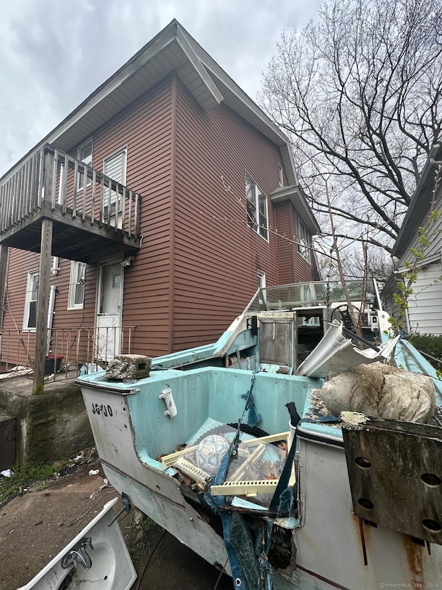 view of side of home with a balcony