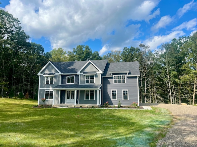 view of front of property featuring a front lawn and a porch