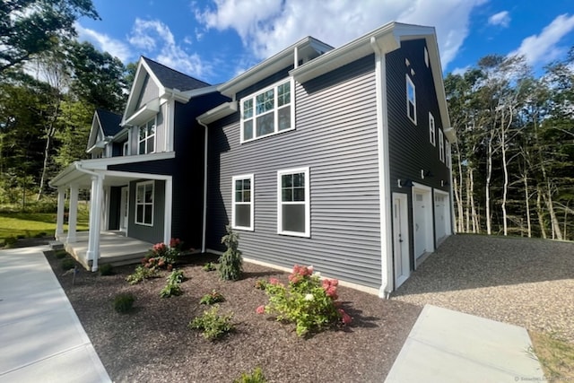 exterior space with a garage and a porch