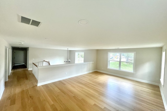 spare room featuring light wood-type flooring