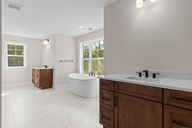 bathroom featuring two vanities, a sink, visible vents, marble finish floor, and plenty of natural light