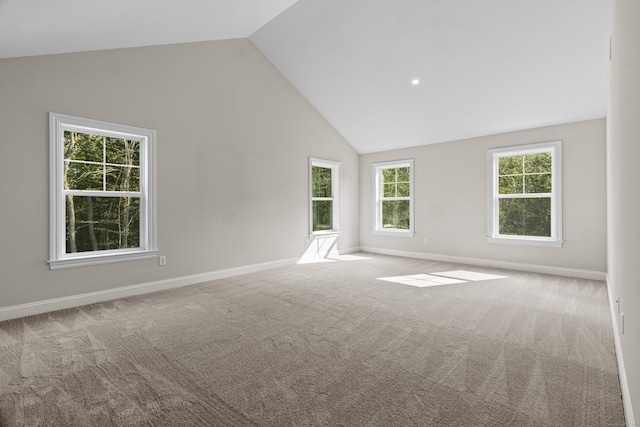 spare room featuring carpet and baseboards