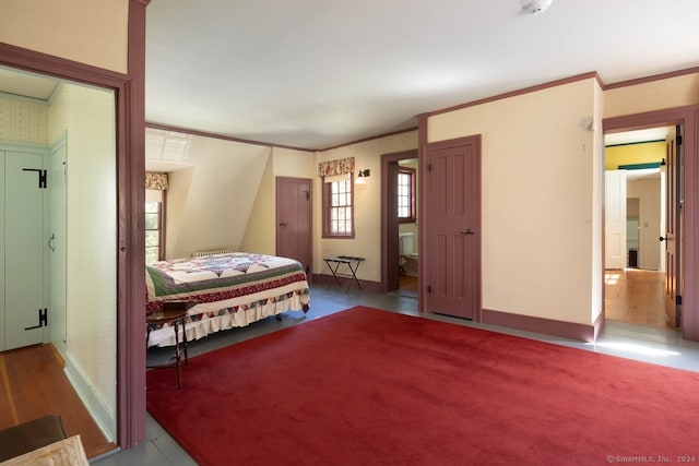 bedroom with crown molding and hardwood / wood-style flooring