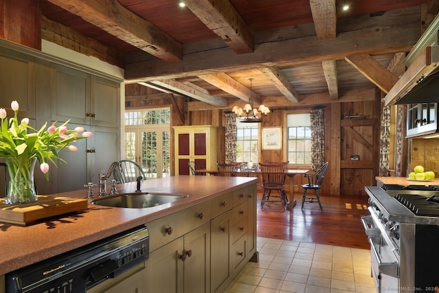 kitchen featuring wooden ceiling, wood walls, stainless steel appliances, and decorative light fixtures