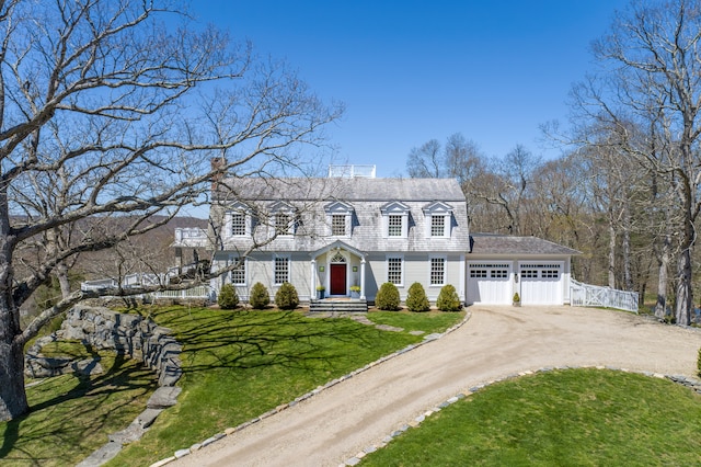 view of front of property with a garage and a front yard