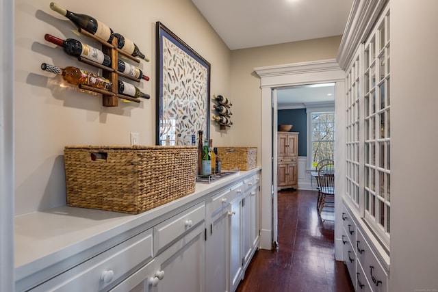 hall featuring dark hardwood / wood-style flooring and ornamental molding