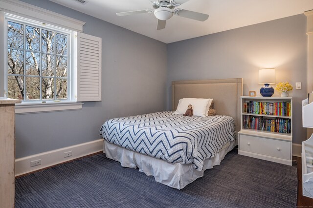 carpeted bedroom with ceiling fan