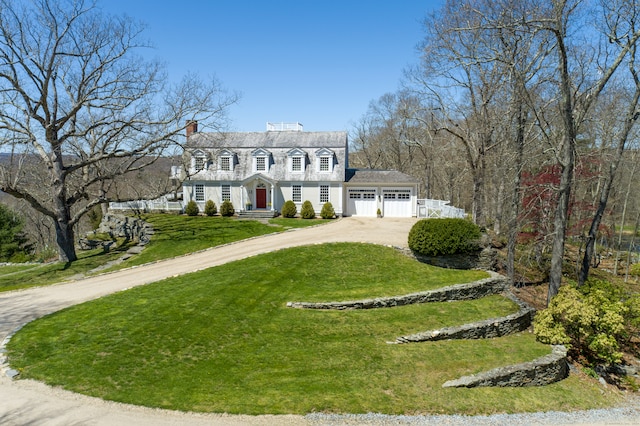 view of front facade featuring a garage and a front lawn