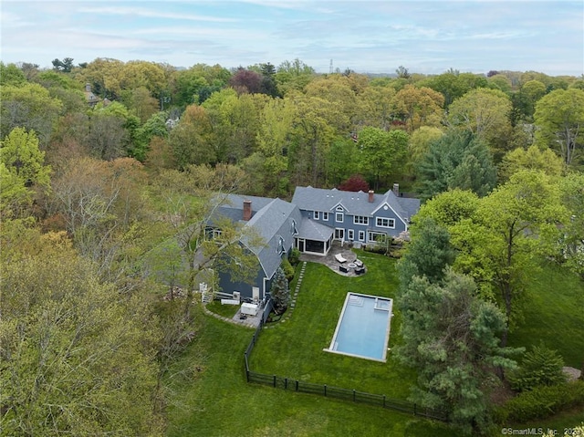 aerial view featuring a wooded view