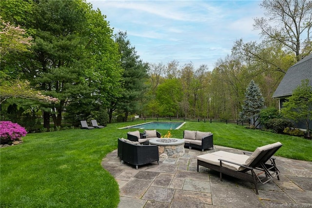 view of patio featuring an outdoor living space with a fire pit and a fenced backyard