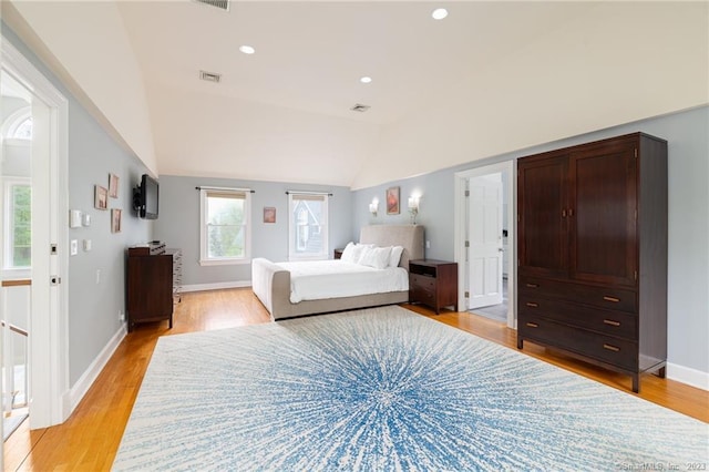 unfurnished bedroom featuring visible vents, baseboards, lofted ceiling, recessed lighting, and light wood-type flooring